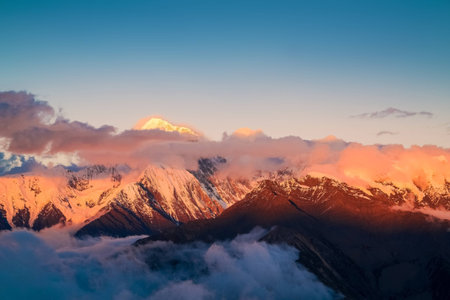 The golden snow mountain panorama of sunrise and sunset in Western Sichuan Chinaの写真素材