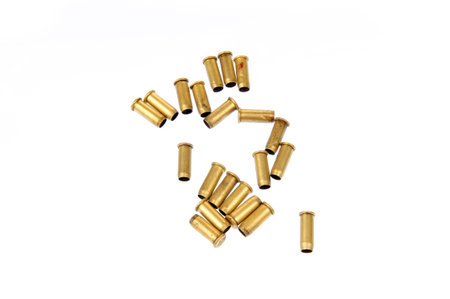 The bullet casings on the white background and filming in the studio 