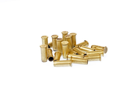 The bullet casings on the white background and filming in the studio 