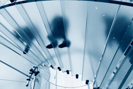 Modern glass stair outline walking man in Shanghai, Chinaの写真素材
