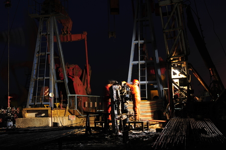 Oil field oil workers at workのeditorial素材