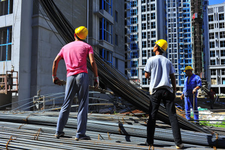 Workers in the production of reinforced concrete frame construction site