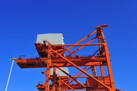 Port crane bridge and bulk carrierの写真素材