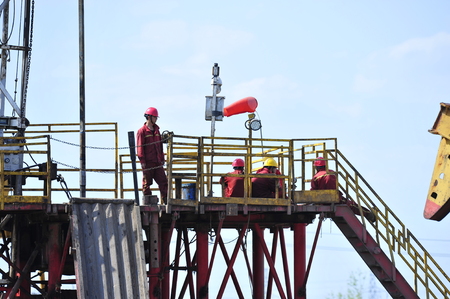 field oil workers at workのeditorial素材