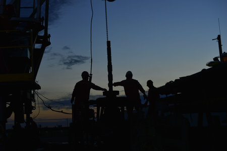 field oil workers at workの写真素材