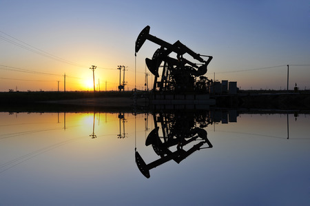 The oil pump during sunsetの写真素材