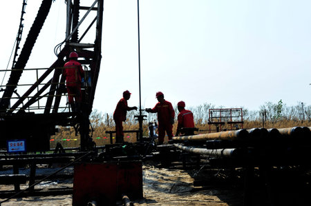 Oil field oil workers at workのeditorial素材