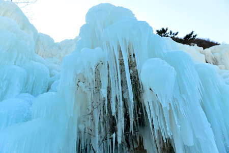 Winter landscape frozen waterfallsの写真素材
