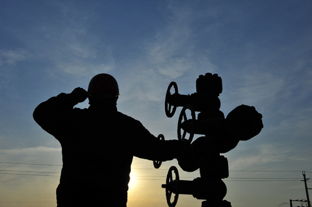 Oil field oil workers at workの写真素材
