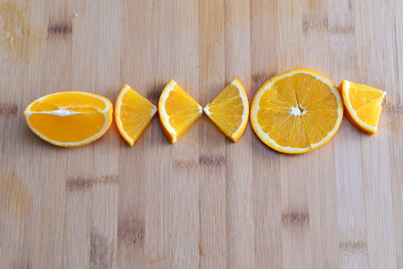 Orange isolated in wooden backgroundの写真素材