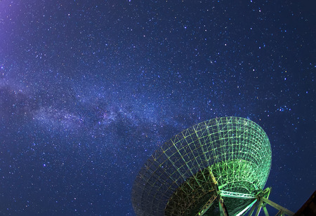Radio telescopes and the Milky Way at nightの写真素材