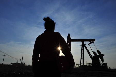 Oil field oil workers at workの写真素材