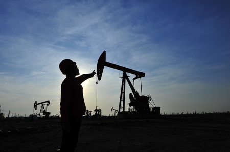 Oil field oil workers at workの写真素材