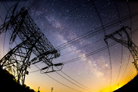 The outline of the power supply facilities and stars at nightの写真素材