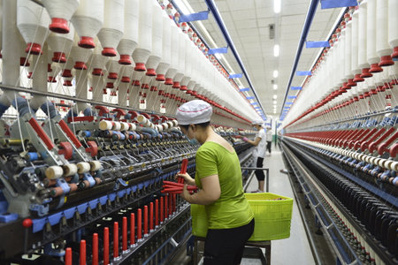 Cotton textile factory equipment in the workshopの写真素材