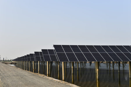 Solar panels power green energy in the blue sky