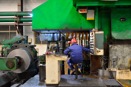 Workers in hot-rolled strip steel mills produce