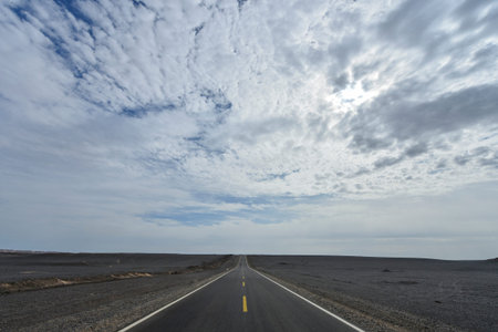Desert road sand dunes in Xinjiang, Chinaの写真素材