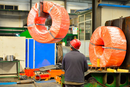 Workers in hot-rolled strip steel mills produce