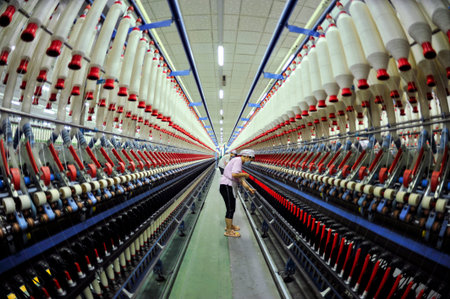 Cotton textile factory equipment in the workshopの写真素材