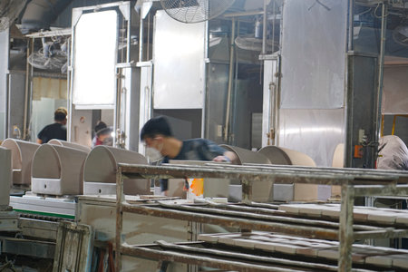 Workers in the toilet production workshop are working on and producing products on the assembly lineの写真素材