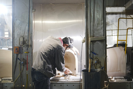 Workers in the toilet production workshop are working on and producing products on the assembly line