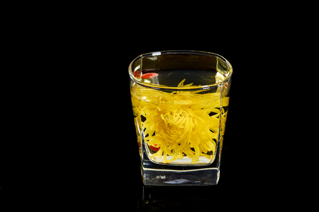 Golden chrysanthemum in the cupの写真素材