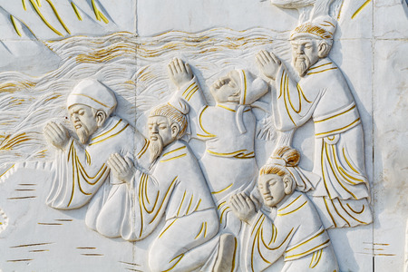 Buddhist believers worship scene reliefの写真素材
