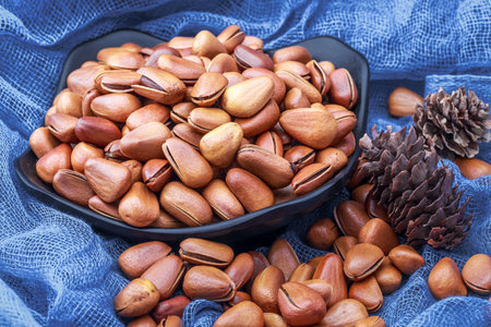 pine nuts on blue background