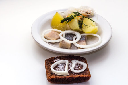 The most favorite and popular russian food is boiled potatoes with herring and onions and sauerkraut...