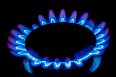 A gas burner with blue burning gas looks like flowerの写真素材