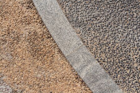 A beautiful texture of path of gray stones and yellow stones is in the parkの写真素材