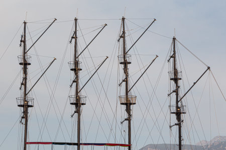 The Beautiful masts of a sailing vessel on the blue sky background