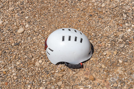 A white helmet on the gravel backgroundの写真素材