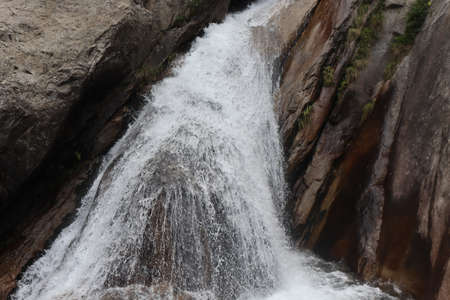 A waterfall is a river or other body of water's steep fall over a rocky ledge into a plunge pool.の写真素材