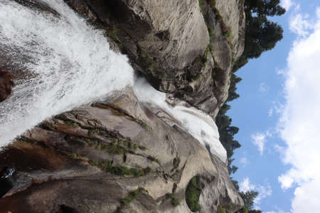 A waterfall is a river or other body of water's steep fall over a rocky ledge into a plunge pool.の写真素材