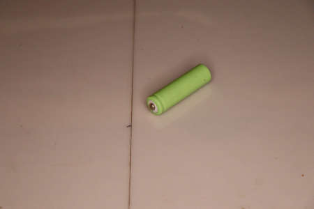 Green battery on a white background. Green battery on a white background.の写真素材