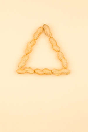 Nuts in a triangleの写真素材