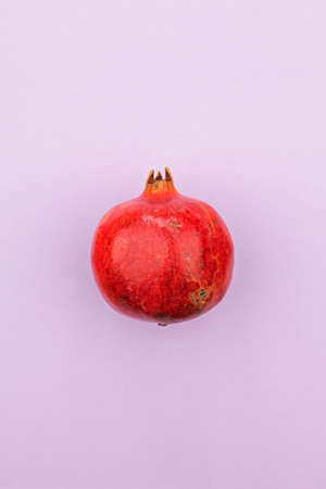 Pomegranate on a purple backgroundの写真素材