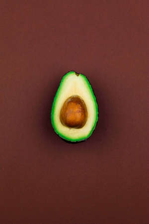 Avocado on a brown backgroundの写真素材