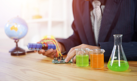 STEM education concept. man coding a meta program it on the computer.electronic board that can be programmed.technology,Mathematics. science. engineering.の写真素材