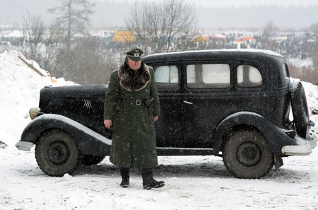 Nazi general stands near retro black carのeditorial素材