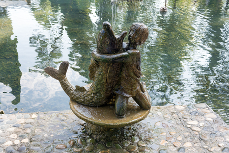Abkhazia, New Athos park monument: a boy hugs fish. Fountainの写真素材