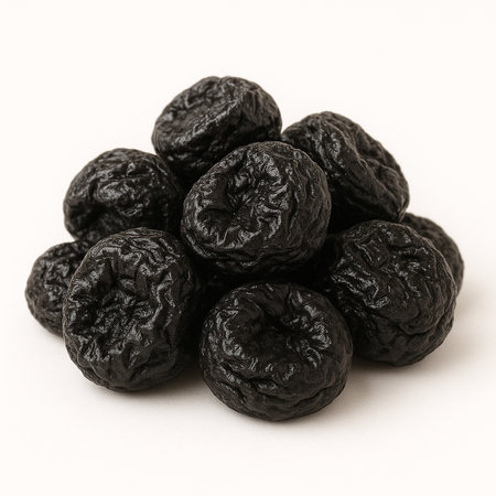 Heap of dried prunes isolated on white background. Close up.の素材