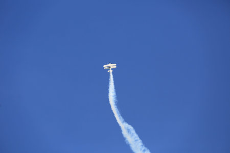Aerobatic airplane flying display and aerobatic show