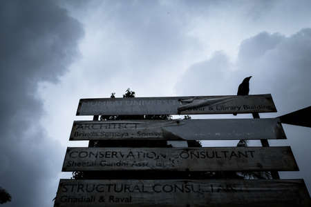 Cloudy day with signboard at the streetのeditorial素材