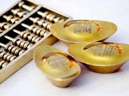 Chinese ingot and abacusの写真素材