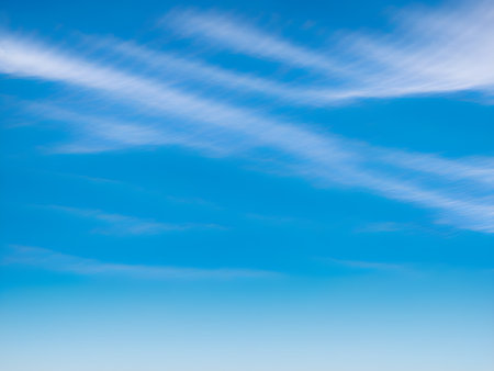 Blue sky background with tiny clouds. Abstract background for your design.の素材