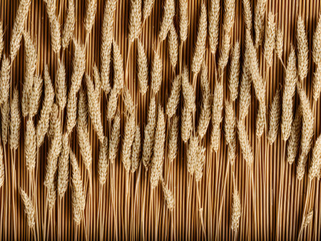 Ears of wheat on a wooden background. Close-up.の素材