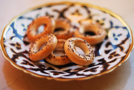 Sushki-traditional russian small bread rings with poppy seeds on top on a plate.の写真素材